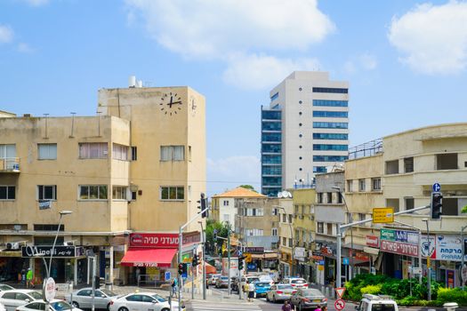 HAIFA, ISRAEL - AUGUST 18, 2016: Scene of Hadar HaCarmel district, with the Beit Hashaon (House of the Clock), local businesses, locals and visitors, in Haifa, Israel
