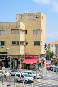 HAIFA, ISRAEL - AUGUST 18, 2016: Scene of Hadar HaCarmel district, with the Beit Hashaon (House of the Clock), local businesses, locals and visitors, in Haifa, Israel