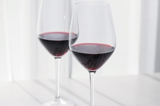 Two crystal glasses of red wine, organic beverage product