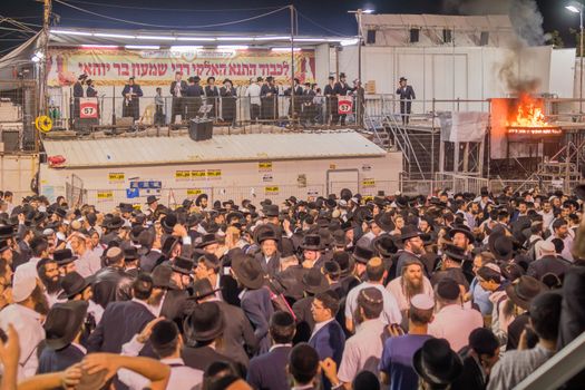 MERON, ISRAEL - MAY 03, 2018: A crowd of orthodox Jews attend and dance, and musicians play, at the annual hillula of Rabbi Shimon Bar Yochai, in Meron, Israel, on Lag BaOmer Holiday