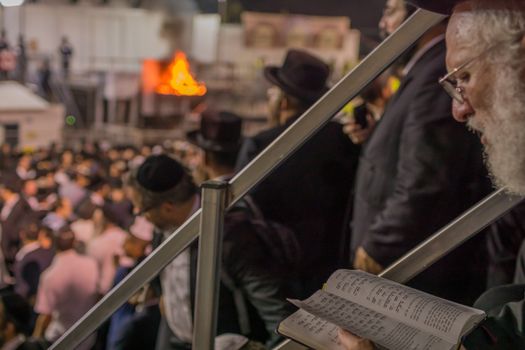 MERON, ISRAEL - MAY 03, 2018: Orthodox Jewish men take part in the annual hillula of Rabbi Shimon Bar Yochai, in Meron, Israel, on Lag BaOmer Holiday