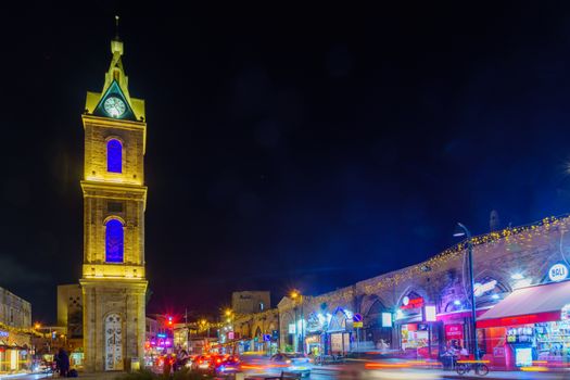 Tel-Aviv, Israel - September 19, 2019: Night view of the Clock tower in the old city of Jaffa, with Locals and visitors. Now part of Tel-Aviv-Yafo, Israel
