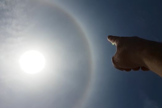 The phenomenon of halo in the sky. A rare natural phenomenon. Three halo suns.