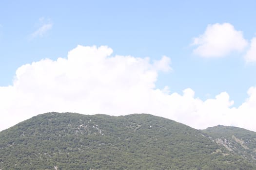 view of green mountains and blue clear sky