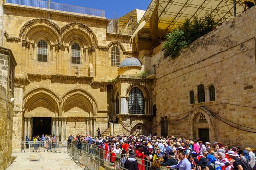 Jerusalem, Israel - April 6, 2018: Orthodox good Friday scene in the entry yard of the church of the holy sepulcher, with a crowd of pilgrims. The old city of Jerusalem, Israel