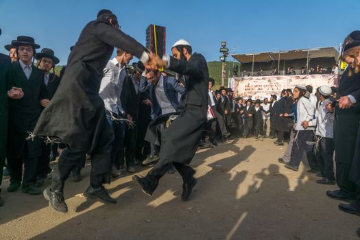 MERON, ISRAEL - MAY 03, 2018: A crowd of orthodox Jews attend and dance, and musicians play, at the annual hillula of Rabbi Shimon Bar Yochai, in Meron, Israel, on Lag BaOmer Holiday