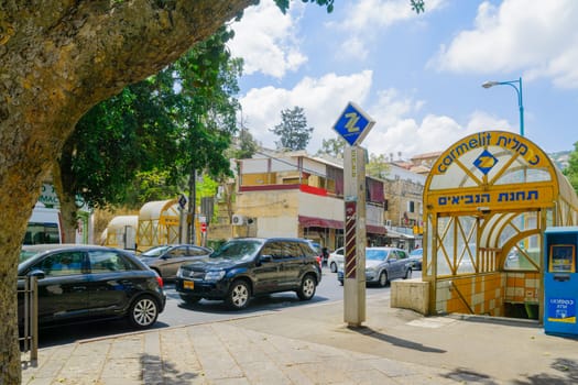 HAIFA, ISRAEL - AUGUST 18, 2016: Scene of Masaryk square in Hadar HaCarmel district, with the Carmelit subway station, local businesses, locals and visitors, in Haifa, Israel