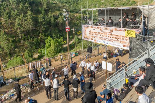 MERON, ISRAEL - MAY 03, 2018: A crowd of orthodox Jews attend and dance, and musicians play, at the annual hillula of Rabbi Shimon Bar Yochai, in Meron, Israel, on Lag BaOmer Holiday