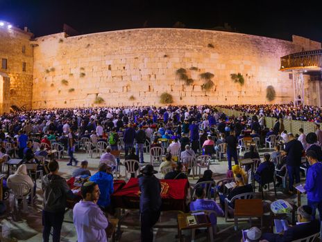 JERUSALEM, ISRAEL - SEPTEMBER 23, 2016: Scene of the western wall with a huge crowd of Selichot (Jewish penitential prays) prayers, in the old city of Jerusalem, Israel. Its an annual Jewish tradition