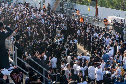 MERON, ISRAEL - MAY 03, 2018: Orthodox Jewish men attend and dance, at the annual hillula of Rabbi Shimon Bar Yochai, in Meron, Israel, on Lag BaOmer Holiday