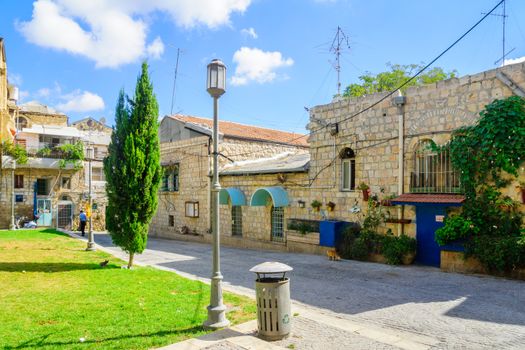 JERUSALEM, ISRAEL - SEPTEMBER 23, 2016: View of an inner yard, with locals, in the historic Nachlaot district, Jerusalem, Israel