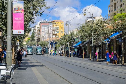 JERUSALEM, ISRAEL - SEPTEMBER 23, 2016: Scene of Yafo Street, with trams, locals and visitors, in Jerusalem, Israel