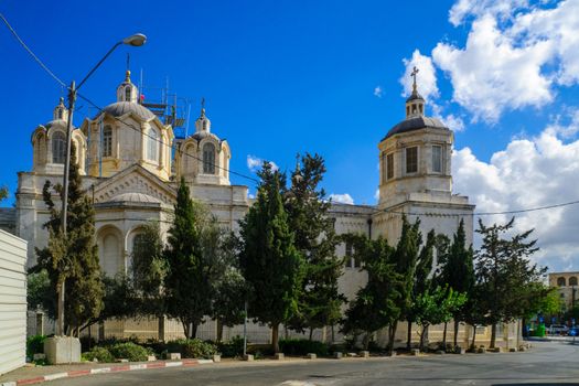 JERUSALEM, ISRAEL - SEPTEMBER 23, 2016: The Holy Trinity Cathedral, in the Russian Compound, with a worker, Jerusalem, Israel