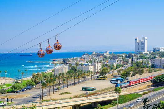 HAIFA, ISRAEL - SEPTEMBER 29, 2016: View of the bay, downtown and the cable car, with locals and visitors, in Haifa, Israel