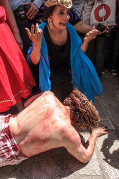 JERUSALEM - APRIL 18, 2014: A group of American actors re-enchant the crucifixion of Jesus Christ along the stations of Via Dolorosa, on Good Friday, in the old city of Jerusalem, Israel