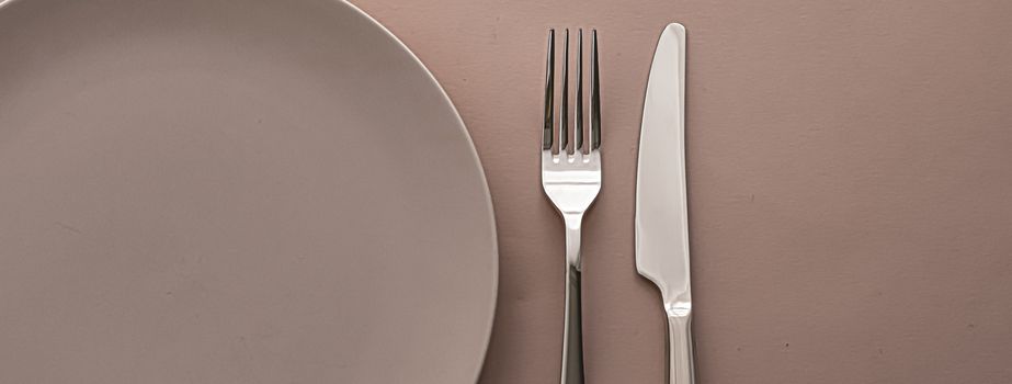 Empty plate and cutlery as mockup set on brown background, top tableware for chef table decor and menu branding design