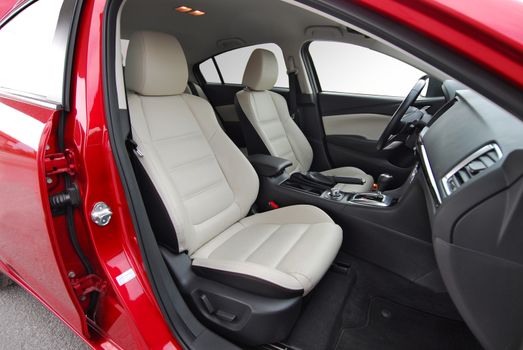 Front seats of a modern car, light leather