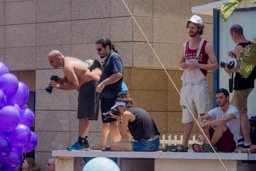 TEL-AVIV, ISRAEL - JUNE 08, 2018: Photographer and others scene, as part of the annual pride parade of the LGBT community, in Tel-Aviv, Israel