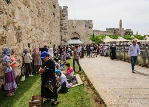 JERUSALEM - APRIL 19, 2014: A crowd of pilgrims outside the Jaffa Gate (in the walls of the old city) waiting for the holy fire ceremony, on Holy Saturday, in Jerusalem, Israel