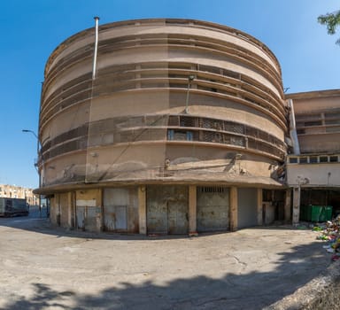 HAIFA, ISRAEL - JUNE 09, 2018: The historic Talpiot market building, built in international (Bauhaus) style, in Hadar HaCarmel neighborhood, Haifa, Israel