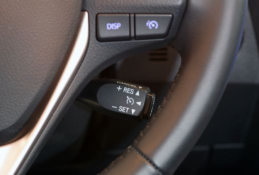 cruise control stick which is located behind the wheel