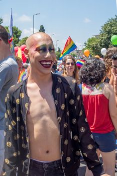 HAIFA, ISRAEL - JUNE 22, 2018: Portrait of a participant, and others in the background, in the annual pride parade of the LGBT community, in Haifa, Israel