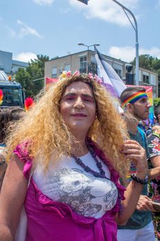 HAIFA, ISRAEL - JUNE 22, 2018: Portrait of a participant, and others in the background, in the annual pride parade of the LGBT community, in Haifa, Israel