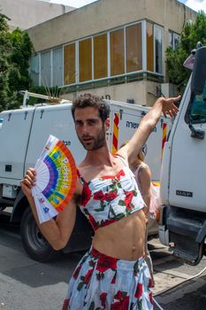 HAIFA, ISRAEL - JUNE 22, 2018: Portrait of a participant, and others in the background, in the annual pride parade of the LGBT community, in Haifa, Israel