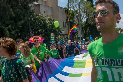 HAIFA, ISRAEL - JUNE 22, 2018: Various people take part and carry signs, in the annual pride parade of the LGBT community, in Haifa, Israel