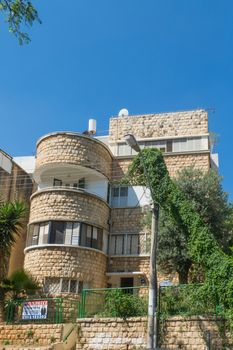 HAIFA, ISRAEL - JUNE 09, 2018: Buildings with a mixture of international (Bauhaus) and Arabic styles, in Hadar HaCarmel neighborhood, Haifa, Israel