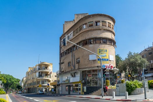 HAIFA, ISRAEL - JUNE 09, 2018: Buildings with a mixture of international (Bauhaus) and Arabic styles, with locals, in Hadar HaCarmel neighborhood, Haifa, Israel