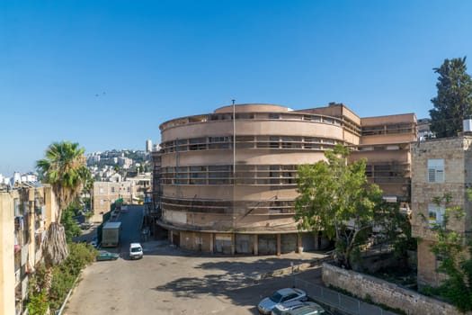 HAIFA, ISRAEL - JUNE 09, 2018: The historic Talpiot market building, built in international (Bauhaus) style, in Hadar HaCarmel neighborhood, Haifa, Israel