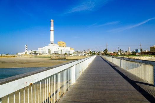 TEL-AVIV, ISRAEL - NOVEMBER 24, 2016: View of the Wauchope Bridge over the Yarkon stream, the Reading Power Station, a lighthouse, and visitors, in Tel-Aviv, Israel