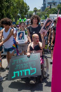 HAIFA, ISRAEL - JUNE 22, 2018: Various people take part and carry signs, in the annual pride parade of the LGBT community, in Haifa, Israel