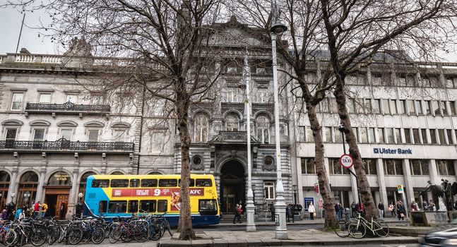 Dublin, Ireland - February 11, 2019: Architectural detail and street atmosphere in front of the Ulster Bank Commercial Bank building in the historic city center on a winter day