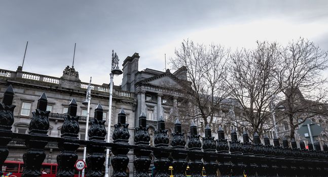 Dublin, Ireland - February 11, 2019: Architectural detail and street atmosphere in front of the Ulster Bank Commercial Bank building in the historic city center on a winter day