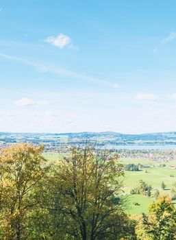 Beautiful nature of European Alps, landscape view of alpine mountains, lake and village on a sunny day, travel and destination scenery