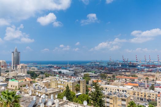 HAIFA, ISRAEL - JULY 20, 2018: View of the downtown district of Haifa, and the harbor from Hadar HaCarmel neighborhood, Haifa, Israel