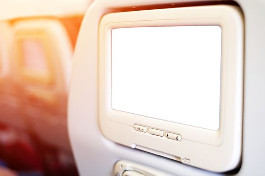 Aircraft monitor in passenger seat isolated on white background with clipping path