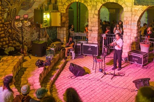 Safed, Israel - August 14, 2018: Scene of the Klezmer Festival, with musician and crowd, in Safed (Tzfat), Israel. Its the 31st annual traditional Jewish festival in the public streets of Safed