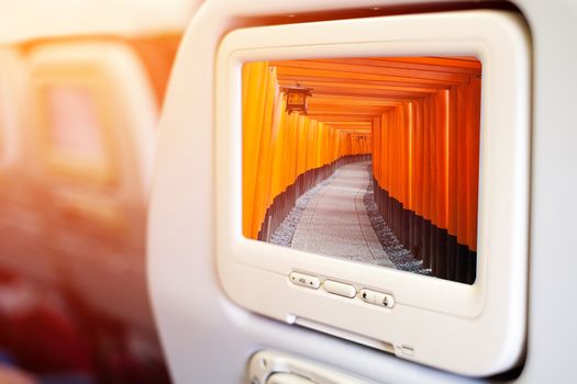 Aircraft monitor in front of passenger seat showing Tori gate at Fushimi Inari Taisha, Kyoto, Japan