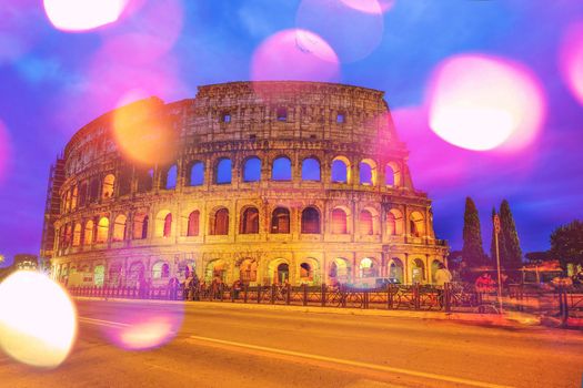 Colosseum, Rome, Italy. Twilight view of Colosseo in Rome with boken effect