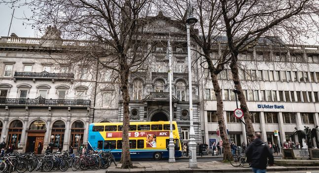 Dublin, Ireland - February 11, 2019: Architectural detail and street atmosphere in front of the Ulster Bank Commercial Bank building in the historic city center on a winter day