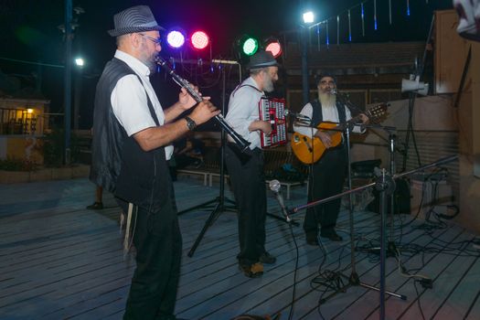 Safed, Israel - August 14, 2018: Scene of the Klezmer Festival, with street musicians playing, in Safed (Tzfat), Israel. Its the 31st annual traditional Jewish festival in the public streets of Safed