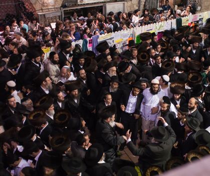 MERON, ISRAEL - MAY 18, 2014: Orthodox Jews dance at the annual hillulah of Rabbi Shimon Bar Yochai, in Meron, on Lag BaOmer Holiday. This is an annual celebration at the tomb of Rabbi Shimon