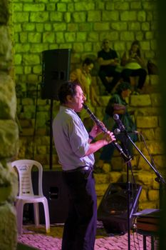Safed, Israel - August 14, 2018: Scene of the Klezmer Festival, with musician and crowd, in Safed (Tzfat), Israel. Its the 31st annual traditional Jewish festival in the public streets of Safed
