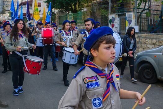 HAIFA, ISRAEL - DECEMBER 10, 2016: Scene of a Christmas parade, with local Arab Christians, and a crowd, as part of the holiday of holidays events, in Haifa, Israel