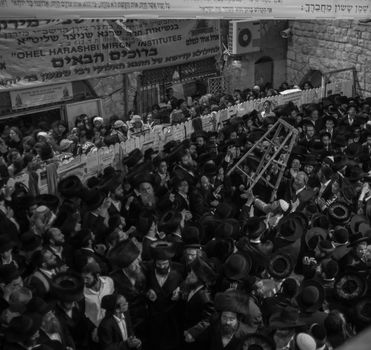 MERON, ISRAEL - MAY 18, 2014: Orthodox Jews dance at the annual hillulah of Rabbi Shimon Bar Yochai, in Meron, on Lag BaOmer Holiday. This is an annual celebration at the tomb of Rabbi Shimon