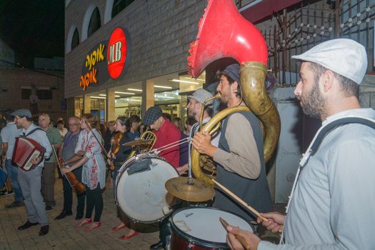 Safed, Israel - August 14, 2018: Scene of the Klezmer Festival, with street musicians and crowd. Safed (Tzfat), Israel. Its the 31st annual traditional Jewish festival in the public streets of Safed