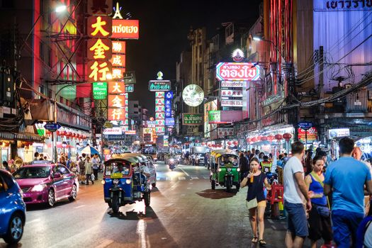 CHINATOWN, BANGKOK, THAILAND - 9 JANUARY, 2016: Cars and shops on Yaowarat road, the main street of China town.